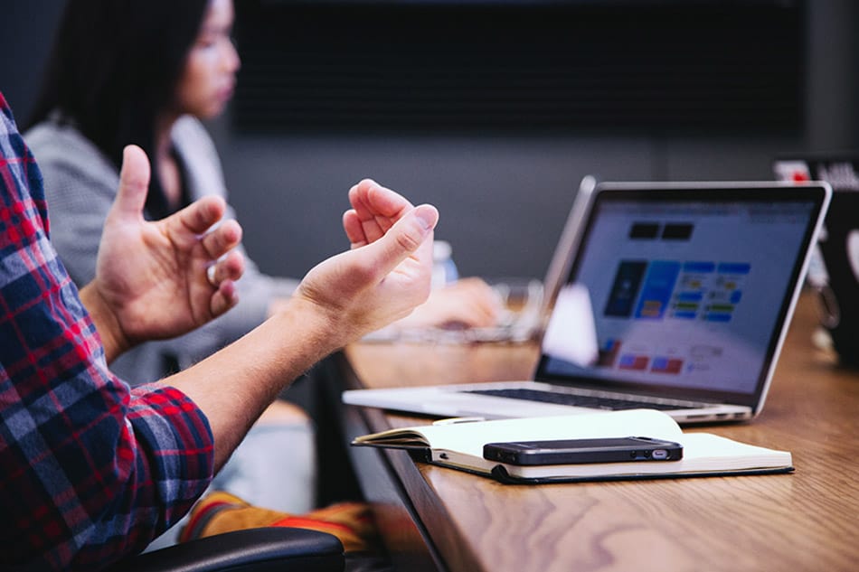 Marketing and sales team discussing account-based marketing strategy and target account selection during a B2B planning session. GNW Consulting.